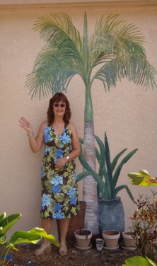 Sherry in front of Trompe L'oeil foliage